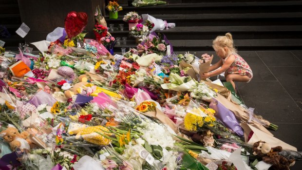 Hundreds of bunches of flowers were laid in Bourke Street in the wake of the tragedy.
