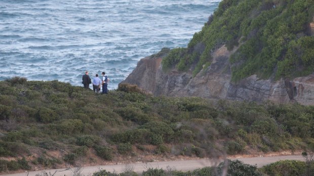 Police look for evidence after a woman's body was found.