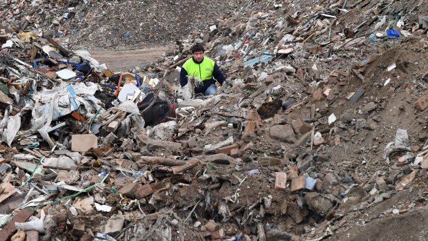 Vasileios Koloutsos is working to clean up the dumped rubbish left on the private property in Thomastown. 