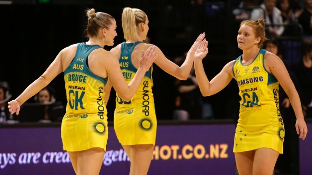 Golden girls: Australian Diamonds players celebrate after a resounding victory over New Zealand.