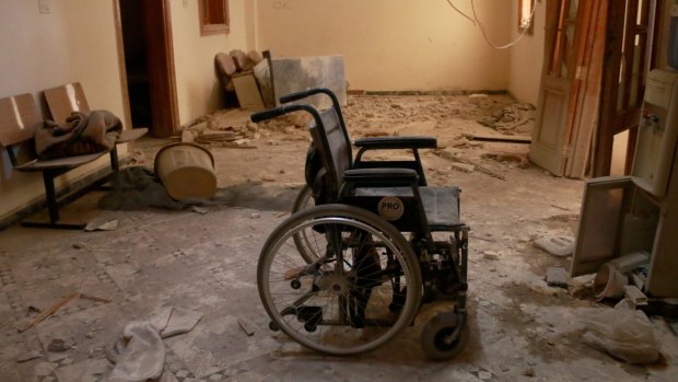 An unusable wheel chair is seen inside the Sahra Hospital after a barrel bomb strike by Syrian regime forces in Aleppo, Syria.
