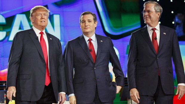 2016 Republican presidential candidates Donald Trump, Ted Cruz and Jeb Bush at the start of the December 15 debate in Las Vegas, Nevada.