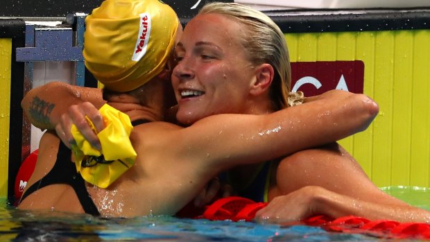 Sarah Sjostrom of Sweden is congratulated by Emma McKeon.