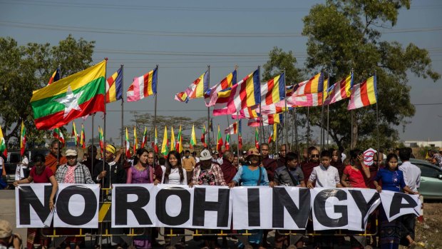 Buddhist chauvinists belonging to the extremist Ma Ba Tha movement protest the use of the word "Rohingya" as a donation ship from Malaysia arrives in Yangon on February 9, 2017.