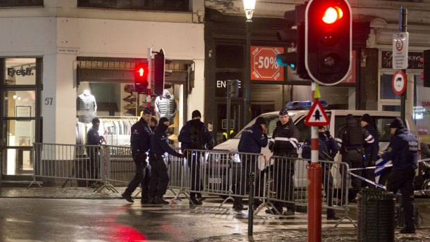 Police set up a barricade during an operation in the center of Brussels on Sunday.