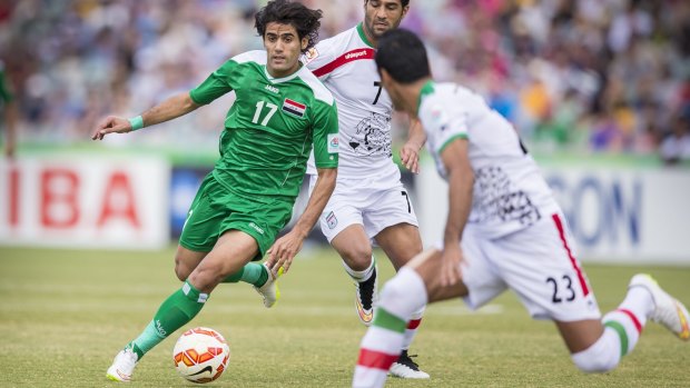 Free to play: Alaa Abdul-Zahra on the ball against Iran. A complaint about his appearance in the Asian Cup has been dismissed. 