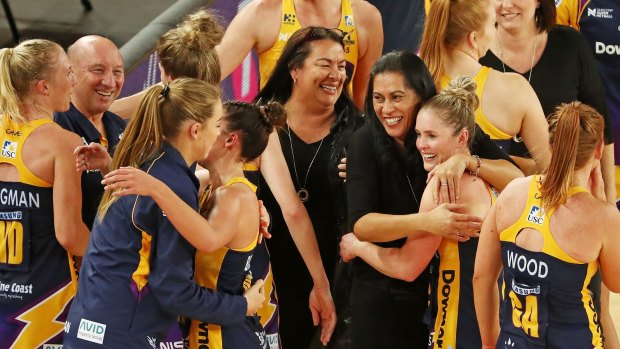 Sunshine Coast Lightning coach Noeline Taurua and her players celebrate after winning the Super Netball major semi-final against the Vixens.