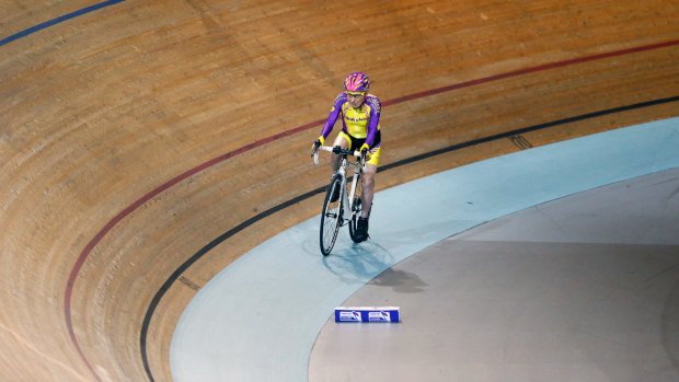 French cyclist Robert Marchand, aged 105, finishes after setting a record for distance cycled in one hour, at the velodrome of Saint-Quentin en Yvelines, outside Paris, Wednesday, Jan. 4, 2017. Frenchman set a world record in the 105-plus age category -- created especially for the tireless veteran -- by riding 22.547 kilometers in one hour. (AP Photo/Francois Mori)