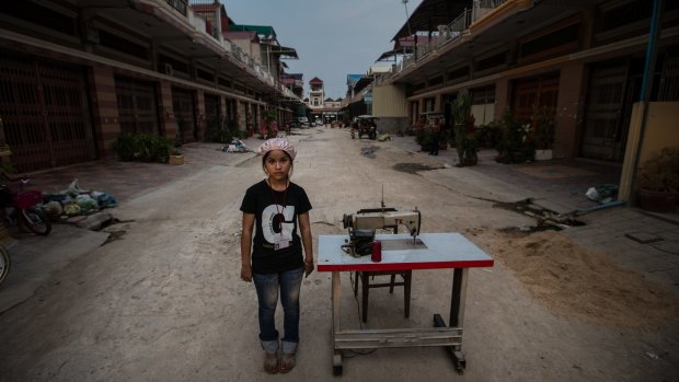 Clothing worker Vien Dyna, 16, says supervisors in a stifling hot Cambodian factory scream abuse at her as she struggles to stitch clothes for fashion brands sold in Western countries like Australia.
