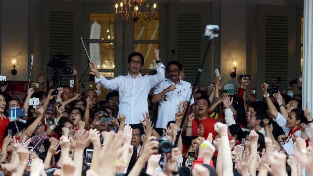 A choir sings outside Jakarta City Hall in support of jailed governor Basuki Tjahaja Purnama, universally known as Ahok.