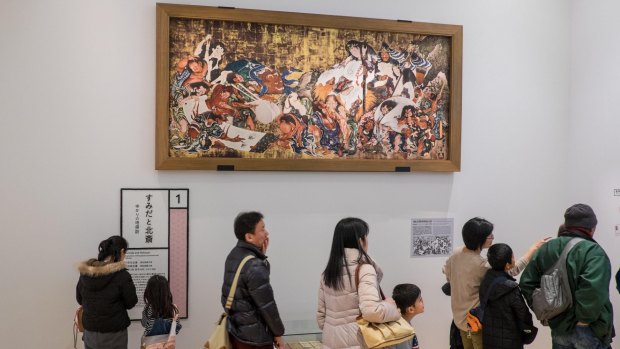 Artworks of Katsushika Hokusai hang in the Sumida Hokusai Museum.