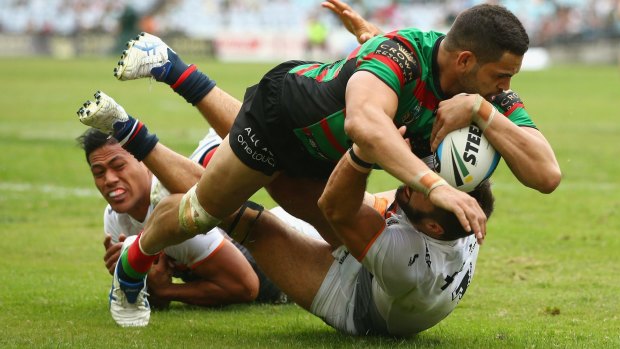 Too strong: Greg Inglis crosses for the Rabbitohs in round 3.