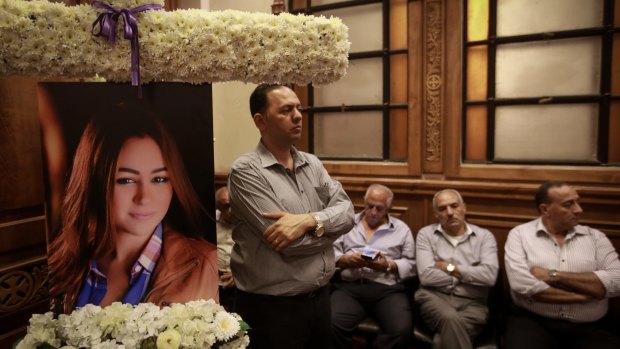 Friends and relatives of EgyptAir hostess Yara Hani who was working aboard EgyptAir MS840 mourn during a ceremony at a church in Cairo on Saturday.