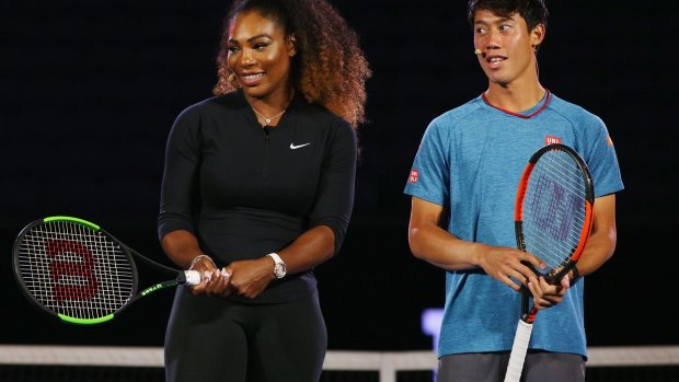 Maintaining focus: Serena Williams, pictured with Kei Nishikori at Melbourne Park on Thursday.