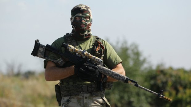 A pro-Russian rebel sniper at a checkpoint on the outskirts of Shakhtersk, in Ukraine's eastern Donetsk region, July 2014.