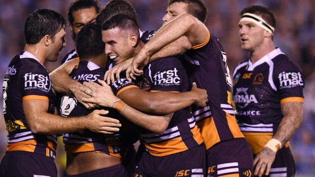 Captain courageous: New skipper Darius Boyd (centre) inspired the Broncos to a gritty win against Cronulla. 