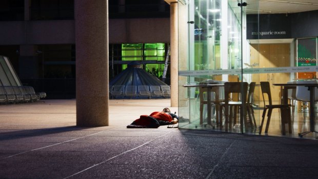 A homeless man spends the night outside the State Library of NSW in Sydney's CBD.