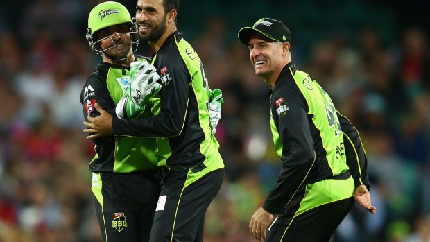All over: Fawad Ahmed of the Thunder celebrates dismissing Johan Botha of the Sixers.
