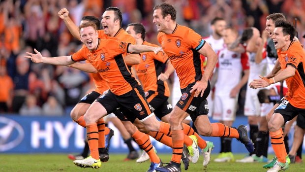 Winners: Brisbane Roar players celebrate after their shootout victory over the Western Sydney Wanderers.