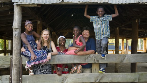 Cay, second from left, and Max Merritt, second from right, with children Philo, 14, Dada, 20, Lussa, 11, and DJ, 12.