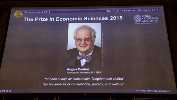 Professor Angus Deaton appears on screen as the winner of the Nobel Prize for Economics at the Royal Swedish Academy of Science, in Stockholm on Monday.