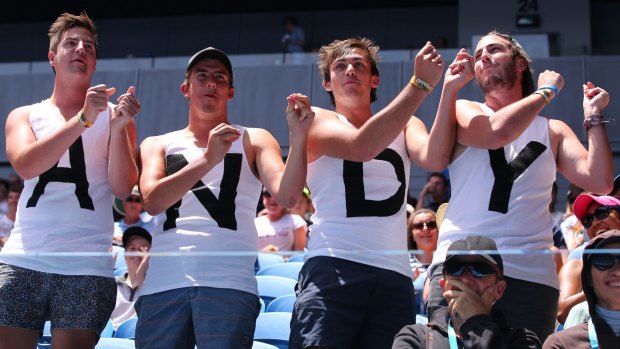Fans watch Andy Murray of Great Britain in his first round match against Yuki Bhambri of India during day one of the 2015 Australian Open at Melbourne Park.