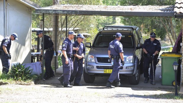 Police conduct a line search of the property where Inspector Bryson Anderson was fatally stabbed in Oakville, north-west of Sydney, in December 2012.