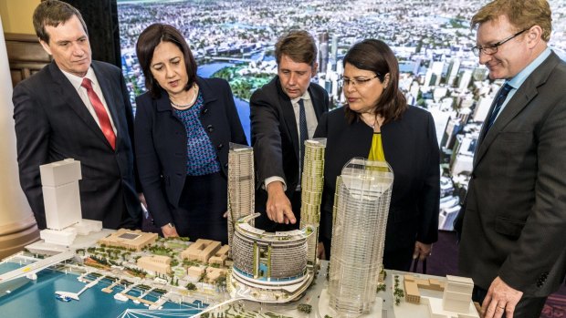 from left, MP Anthony Lynham, Queensland Premier Annastacia Palaszczuk, CEO of Echo Entertainment - Matthew Bekier, MP Grace Grace and Echo Entertainment Queensland director Geoff Hogg looking at a model of the waterfront casino to be built in Brisbane.