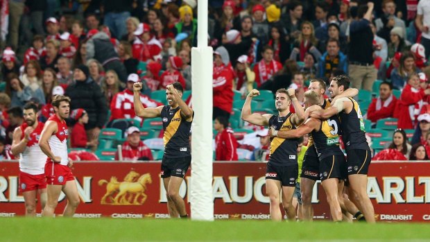 Big win: Jack Riewoldt and Tigers teammates celebrate winning at the SCG.
