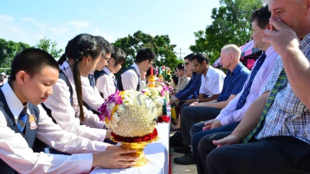 Students at the Narinukun school pay respect to teachers during a Thai ceremony on June 26, 2015. 
Peter Dundas Walbran is third from right, wearing blue short-sleeve shirt. 