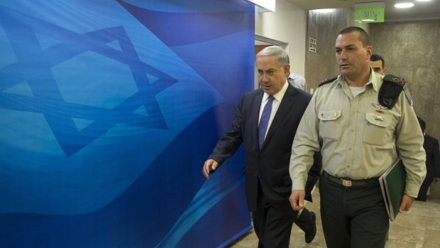 Israeli Prime Minister Benjamin Netanyahu arrives to chair the weekly cabinet meeting at his Jerusalem office on Sunday. 