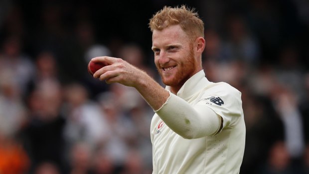 Ben Stokes raises the ball after his fifth wicket against the West Indies.