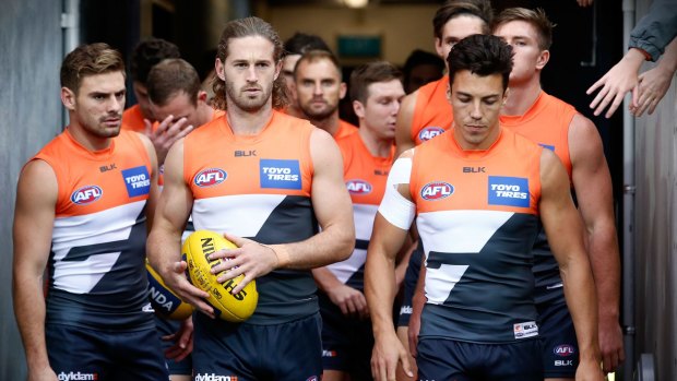 High standards: Callan Ward leads the team onto the field during the 2016 AFL Round 11 match between the Geelong Cats and the GWS Giants at Simonds Stadium.