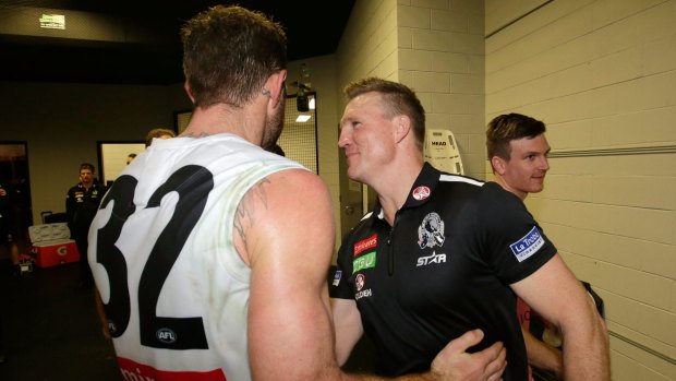Side by side: Nathan Buckley congratulates Travis Cloke after the game.