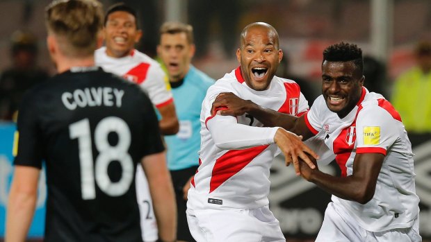 Peru's Christian Ramos, right celebrates after scoring his side's second goal.