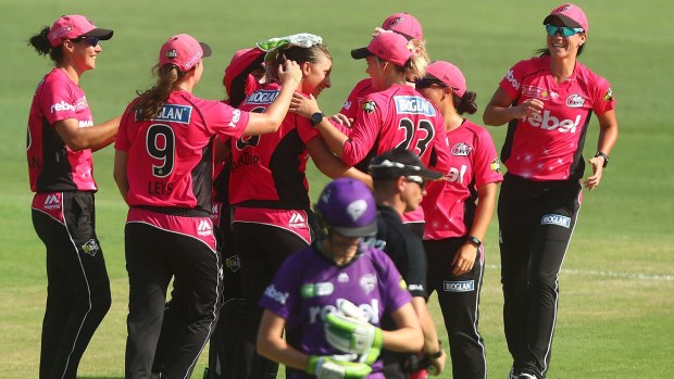 Final-bound: The Sydney Sixers celebrate a wicket during their crushing 103-run win over the Hurricanes in their WBBL semi-final. 