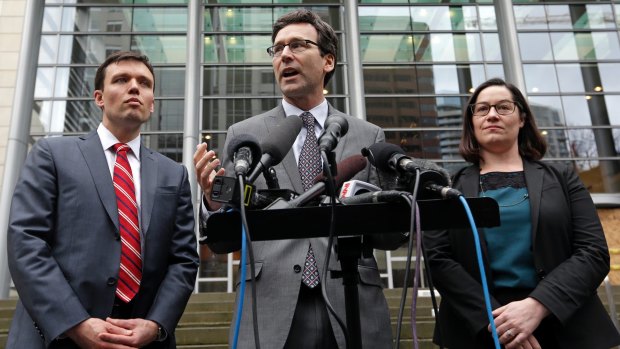 Washington Attorney-General Bob Ferguson, centre, with Solicitor General Noah Purcell, left, and Civil Rights Unit Chief Colleen Melody in Seattle, says the ban discriminates against Muslims.