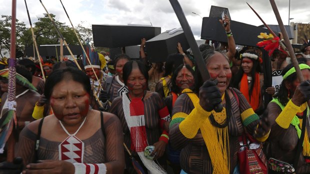 Indigenous women protest for the demarcation of indigenous lands outside the Brazilian National Congress in Brasilia on Tuesday.