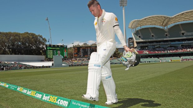Sad walk off: Michael Clarke leaves the Adelaide Oval after injuring his back.