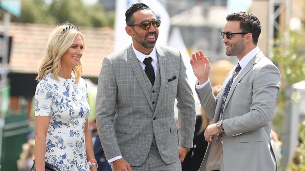 Jimmy Bartel (right) catches up with ex-Sydney Swan and fellow Brownlow medallist Adam Goodes at the Caulfield Cup. 