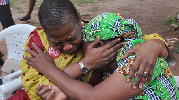 "Bring Back Our Girls" co-founder Obiageli Ezekwesili, left, consoles Esther Yakubu after she saw her daughter in a video released by Boko Haram.