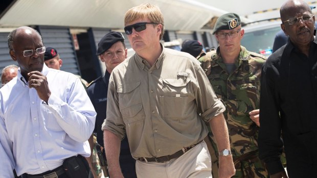Dutch King Willem-Alexander, centre, visits St Maarte in the Dutch Caribbean after the passing of Hurricane Irma in September.