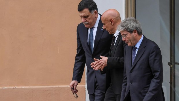 From left, Libyan PM Fayez al-Sarraj, Italian Interior Minister Marco Minniti, and Italian PM Paolo Gentiloni arrive for a meeting on migration in Rome on Monday.