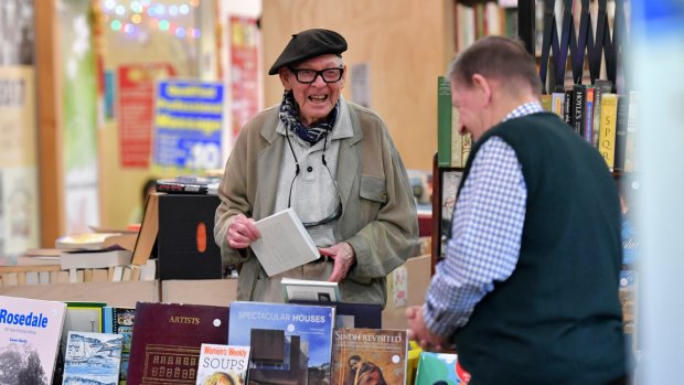 Treasured day out: Cartoonist and illustrator Vane Lindesay, 96, left, chats with Merchant of Fairness bookshop owner Rod Cameron at South Melbourne Market, which is turning 150. 