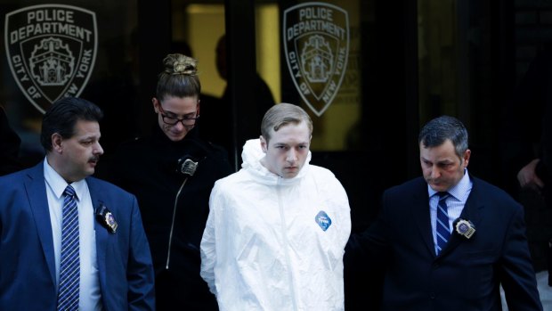James Harris Jackson is escorted out of a police precinct in New York on Wednesday.