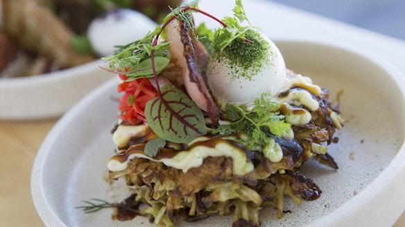 Okonomiyaki (savoury pancake) with bacon and poached egg.