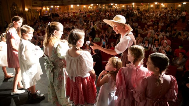 Moviegoers get dressed up and into the swing of things for the <i>Sound Of Music</i> singalong at the State Theatre.

