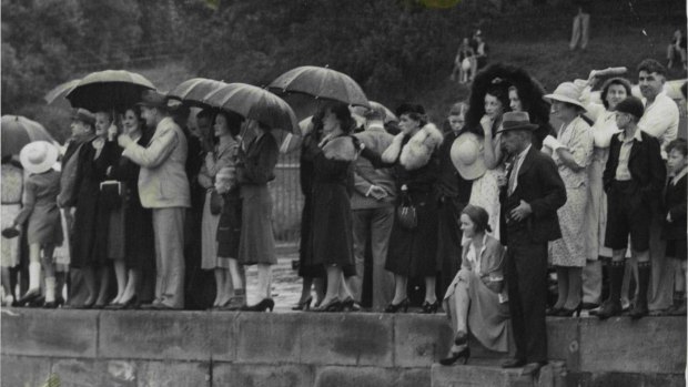 Anxiously awaiting news, crowds stood in pouring rain at Fort Macquarie. Many were relatives of the survivors, and touching reunions took place on the wharf. 