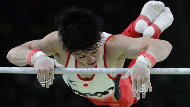 Japan's Kohei Uchimura performs on the horizontal bar during the artistic gymnastics men's individual all-around final.