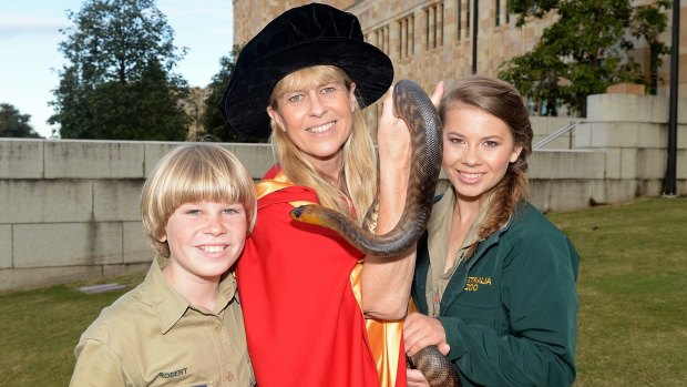 Terri Irwin with son Robert and daughter Bindi after receiving her honorary degree from the University of Queensland.